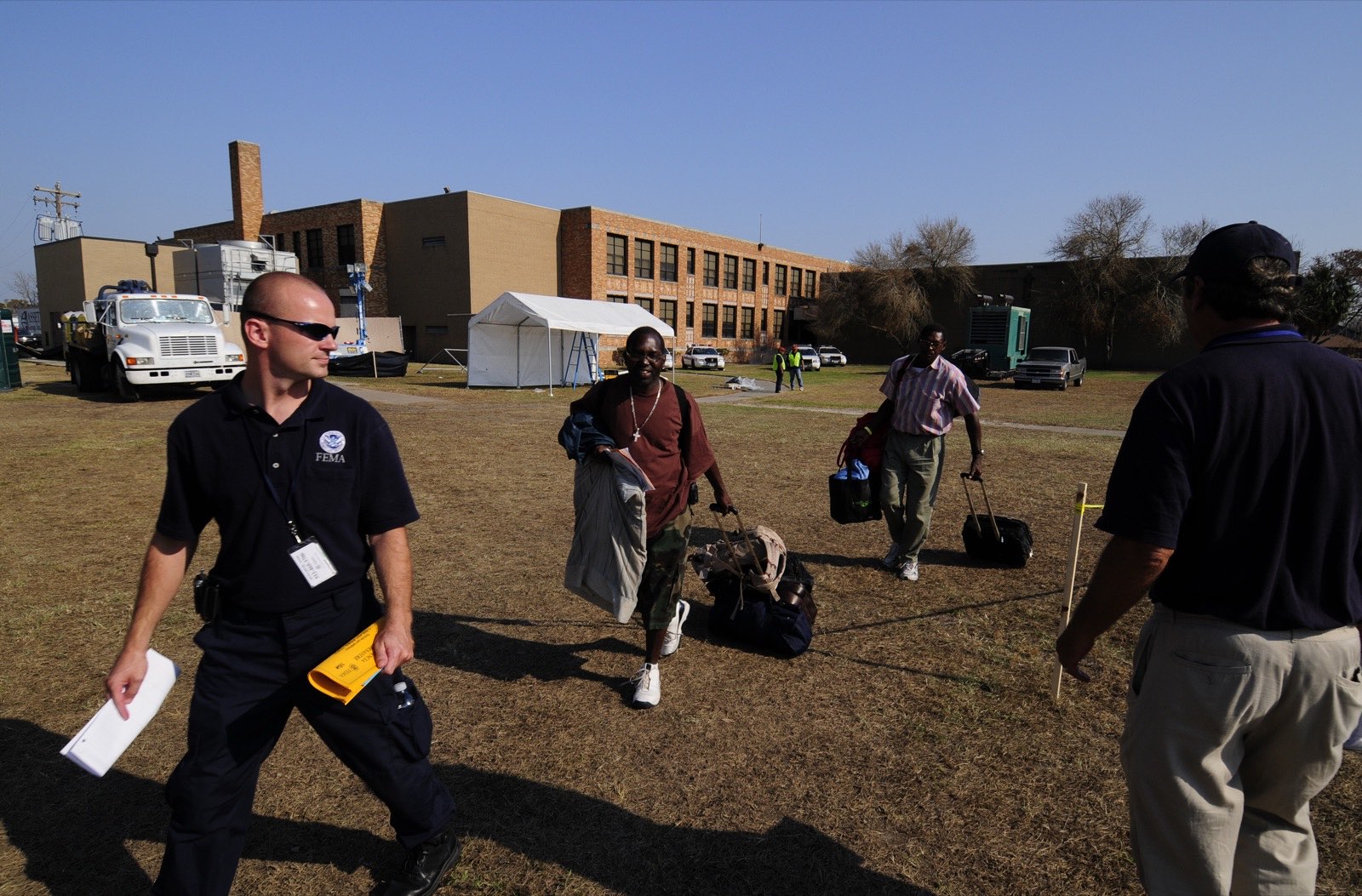 Evacuated residents return to their flood-affected neighborhood after an evacuation order is lifted